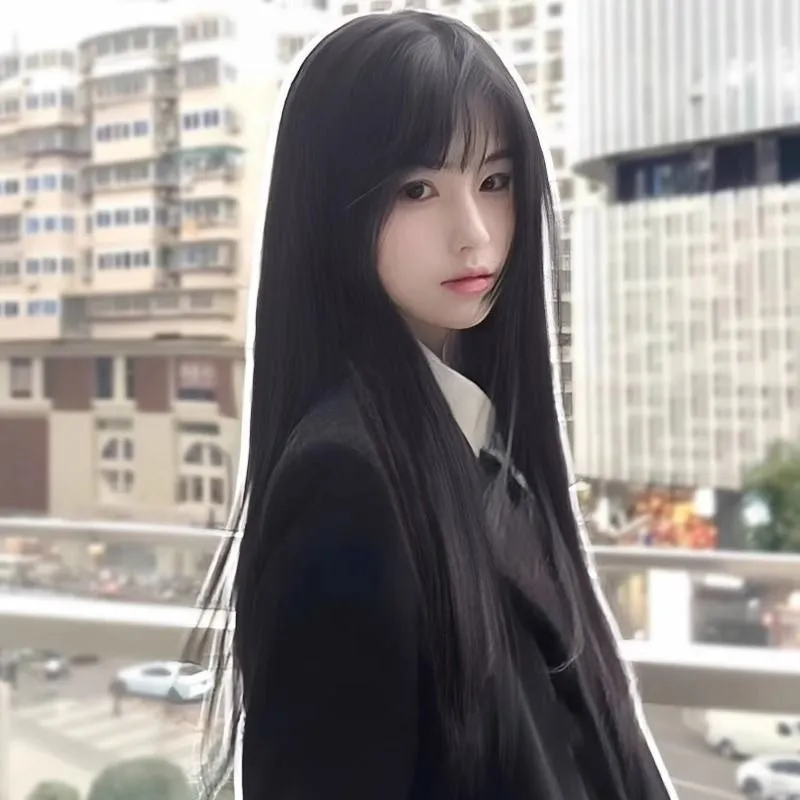 Long straight black synthetic wig with full blunt bangs on a wig stand.