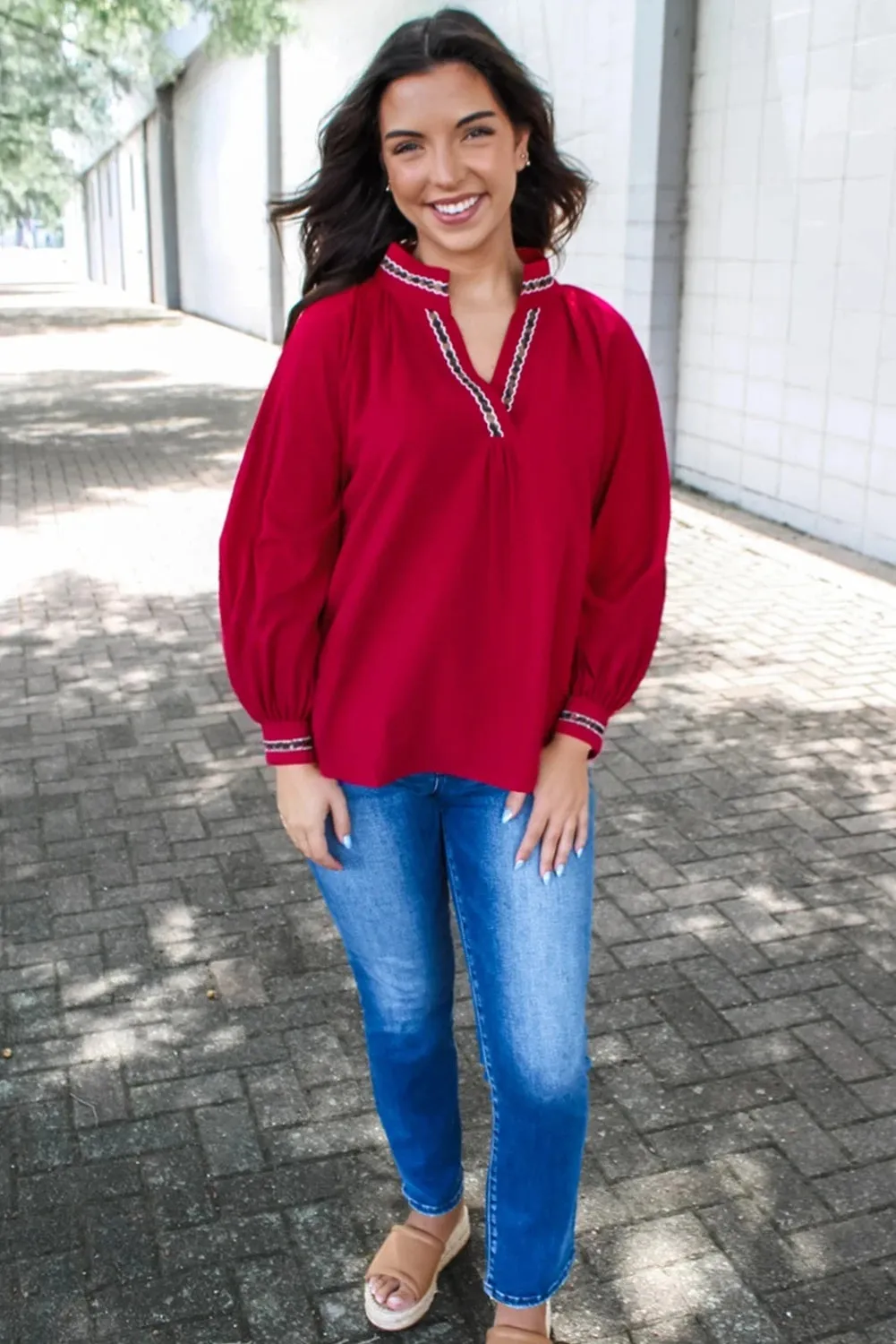 Women's red polyester pullover shirt with embroidered collar and printed design, loose fit