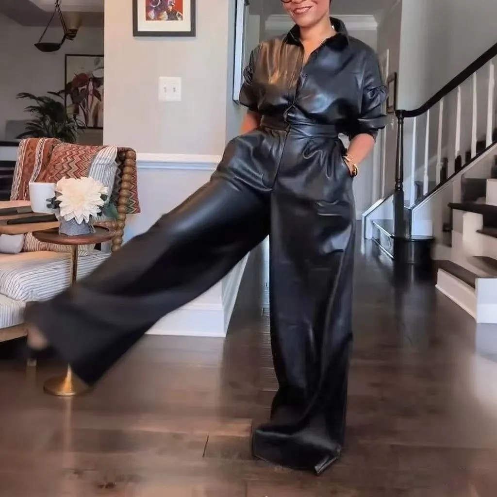 Black PU retro loose jumpsuit with puff sleeves, high waist, button front, and splicing details