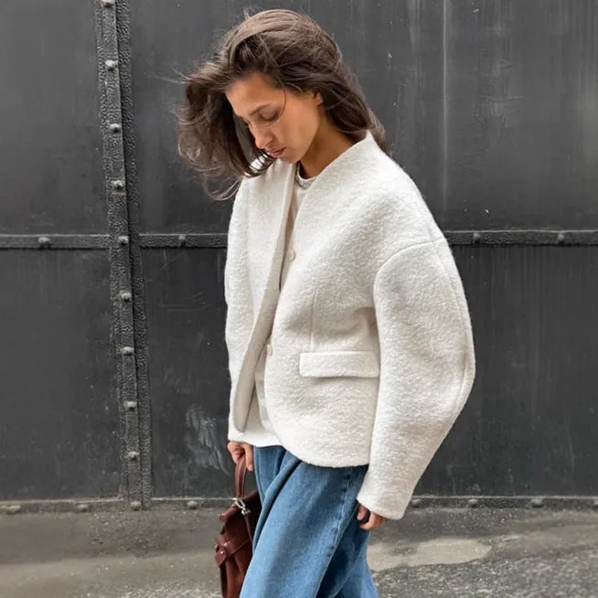 Women's coarse woolen thick polyester coat in solid white with raglan sleeves and stitching details