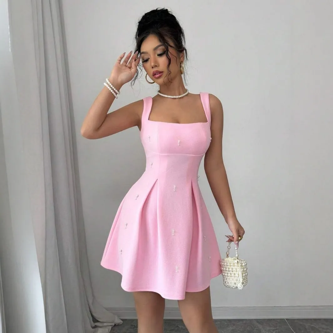 Pink high-waist suspender dress with A-line skirt and sleeveless design, made from polyester.