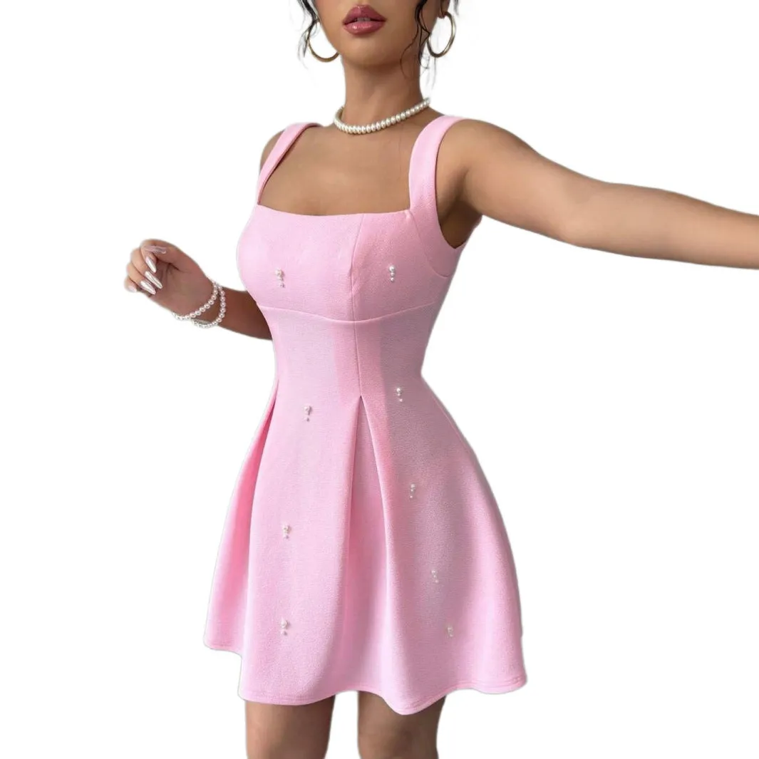 Pink high-waist suspender dress with A-line skirt and sleeveless design, made from polyester.