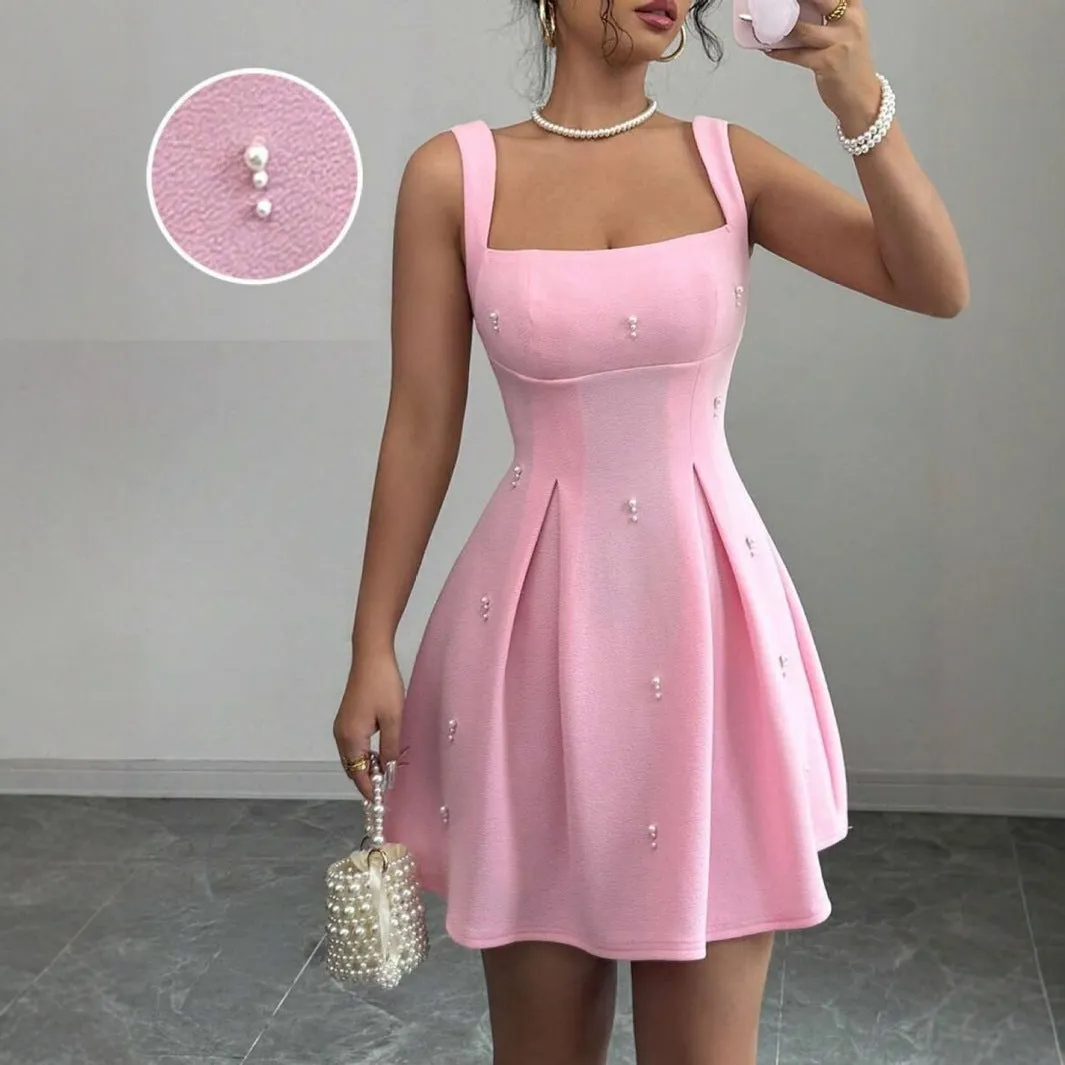 Pink high-waist suspender dress with A-line skirt and sleeveless design, made from polyester.