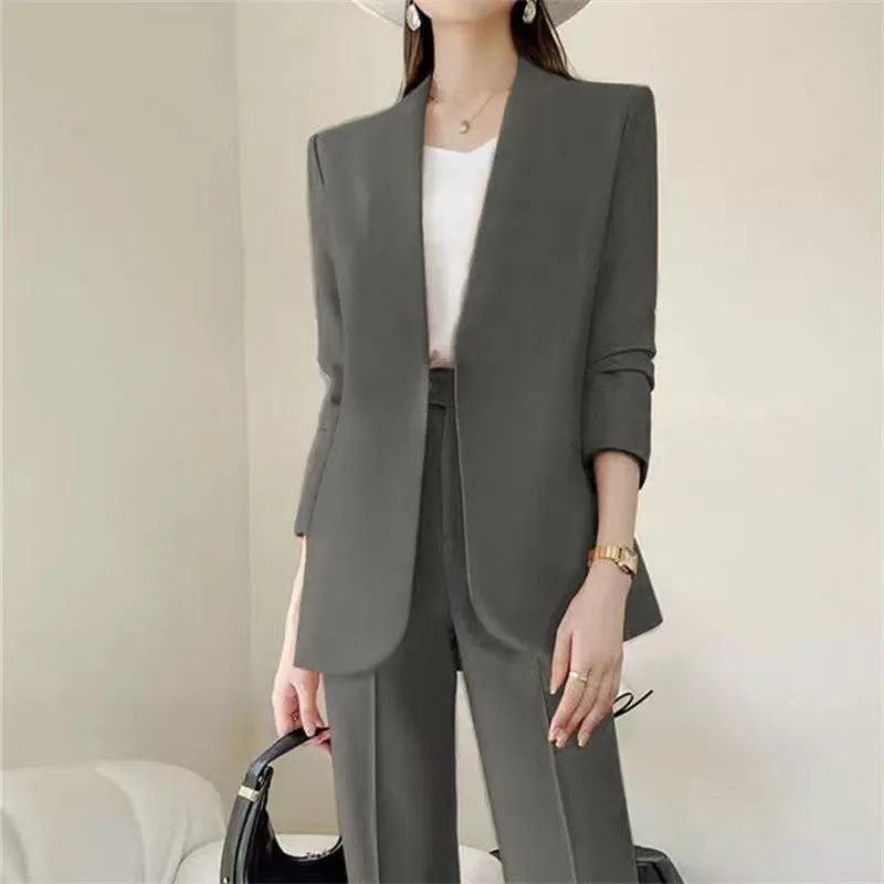 Women's polyester business suit set with blazer and trousers in beige, model standing