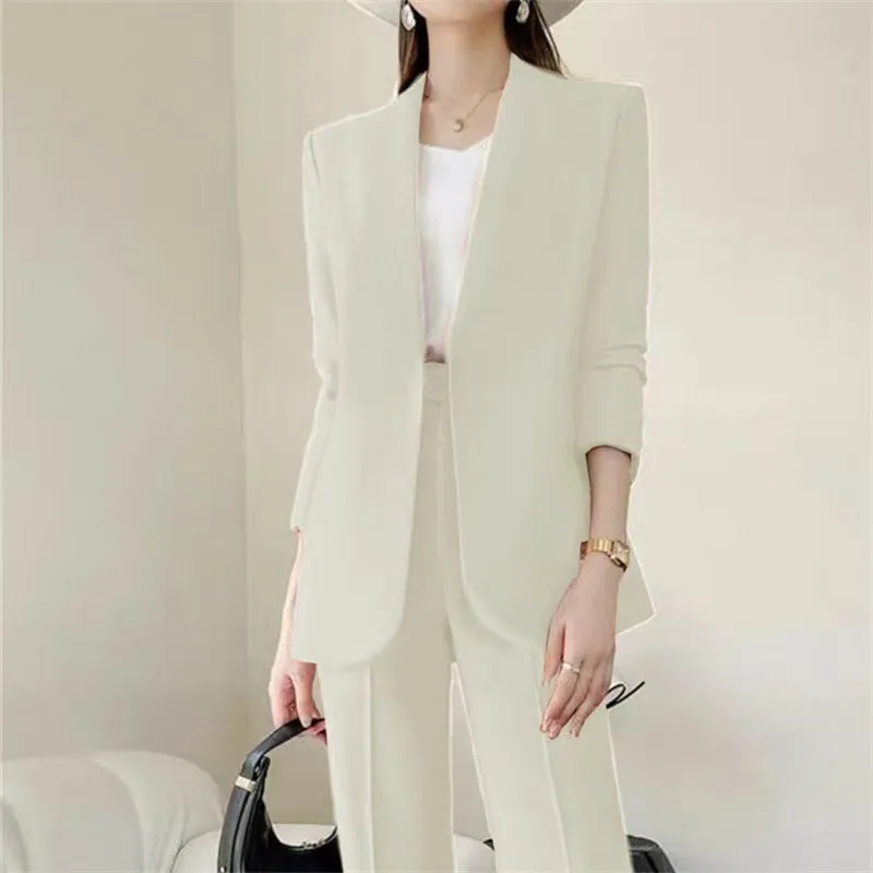 Women's polyester business suit set with blazer and trousers in beige, model standing