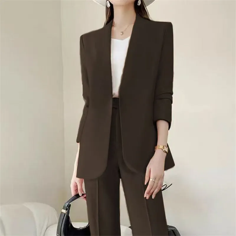 Women's polyester business suit set with blazer and trousers in beige, model standing