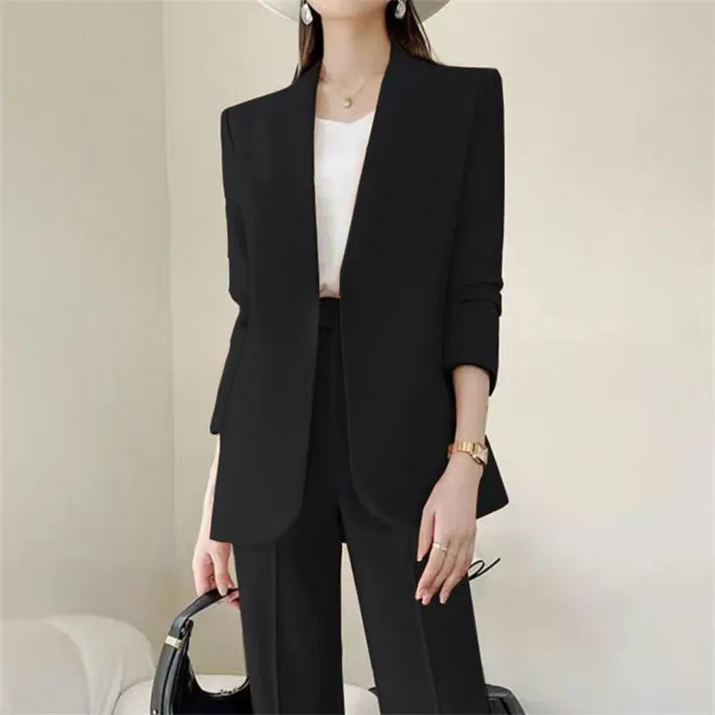 Women's polyester business suit set with blazer and trousers in beige, model standing