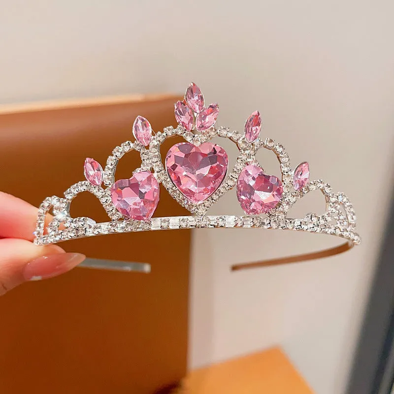 Children's metal alloy crown headdress hairband in pink, light blue, or light purple with crystal decoration.