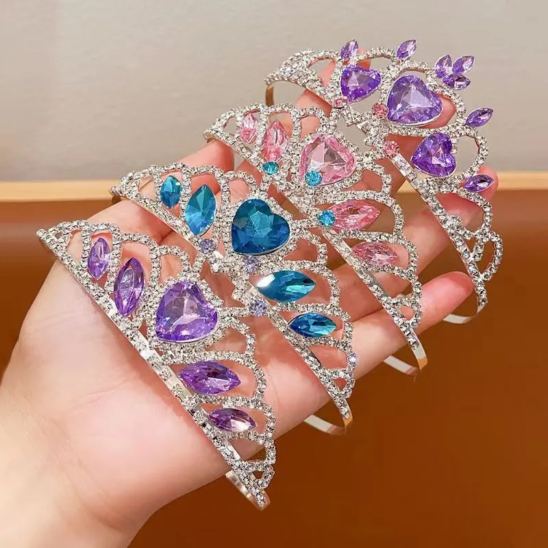 Children's metal alloy crown headdress hairband in pink, light blue, or light purple with crystal decoration.