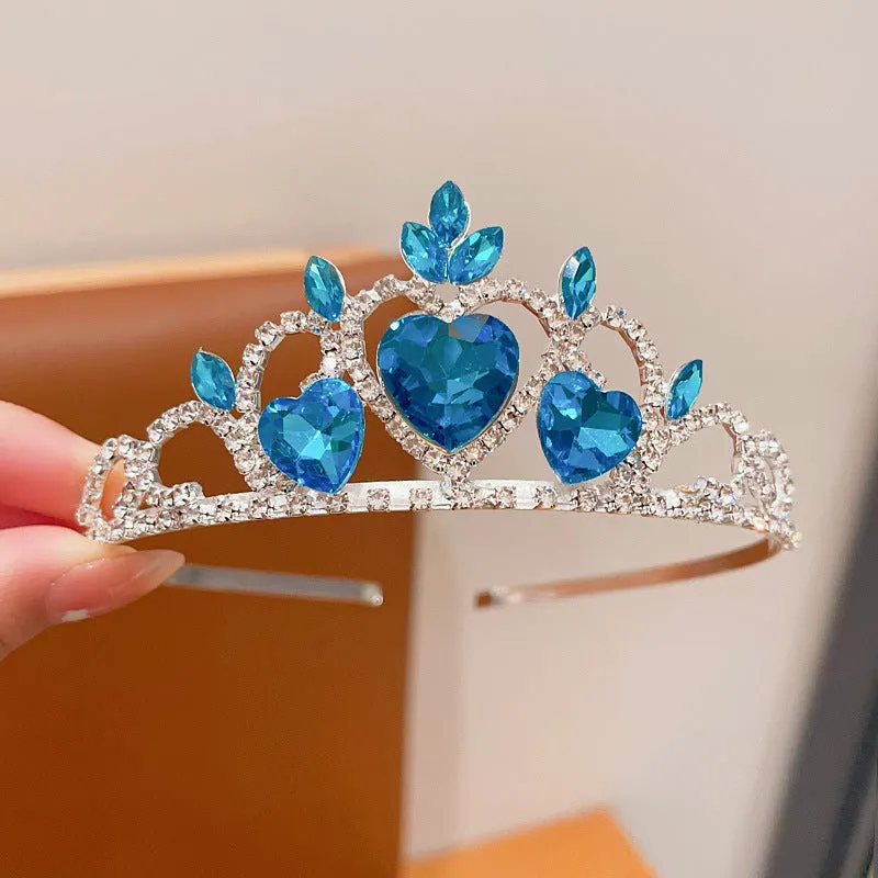 Children's metal alloy crown headdress hairband in pink, light blue, or light purple with crystal decoration.