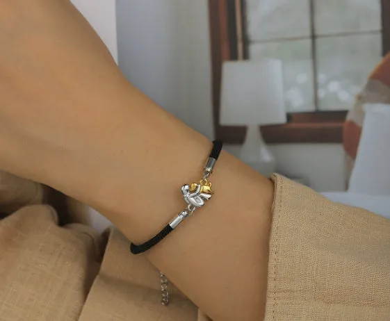 Woven angel motif couple bracelet in black with electroplated flexible wire finish