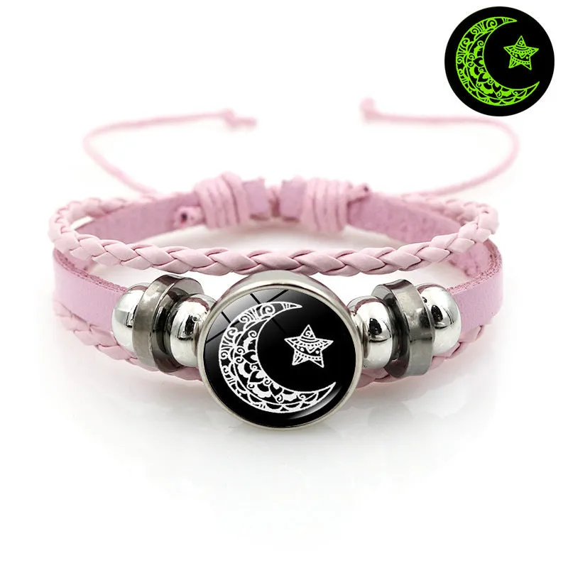 Luminous sun and moon couple leather bracelet on black background, showing glass pattern and adjustable chain