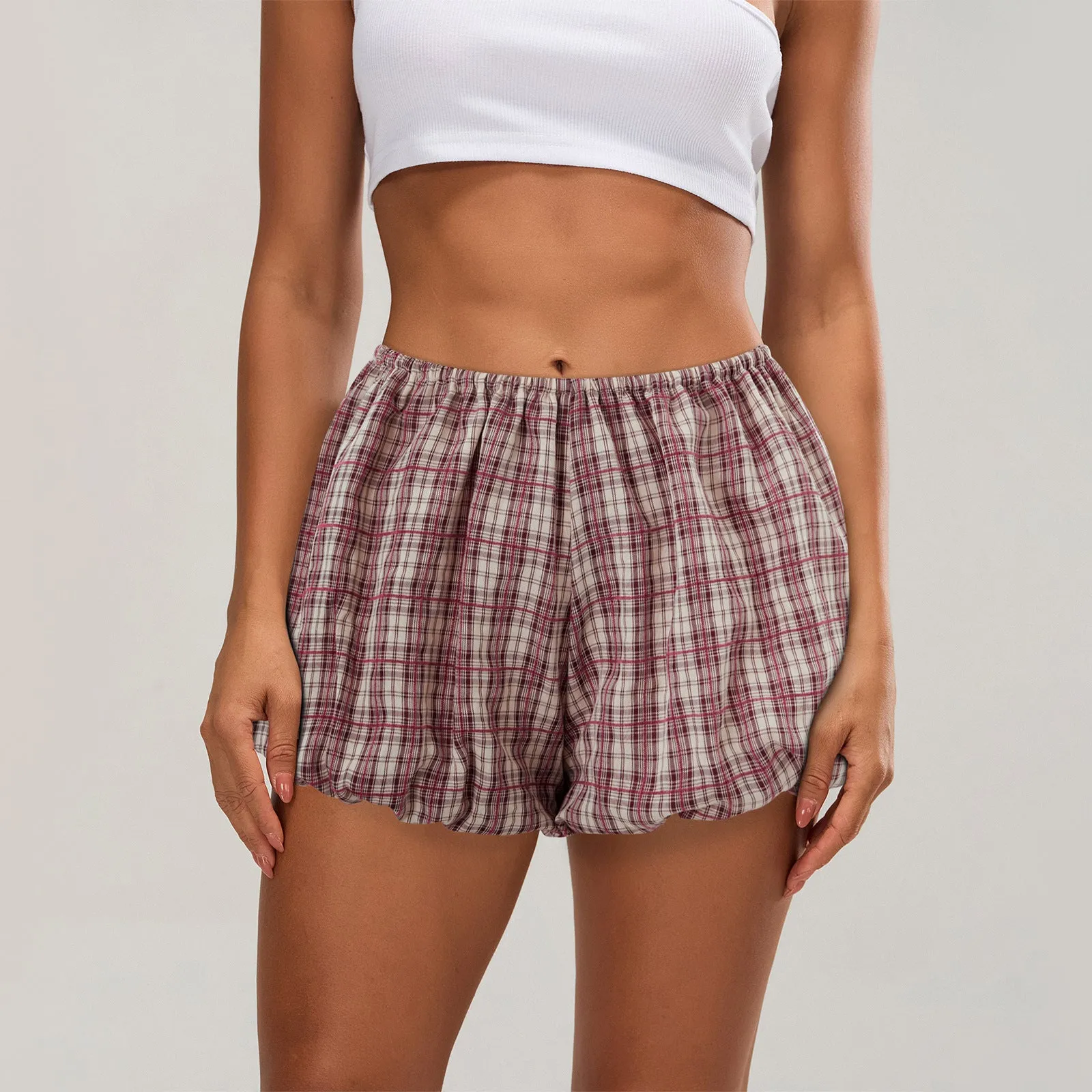Women's casual polyester shorts with elastic waist in dark khaki colour showing printed fold details