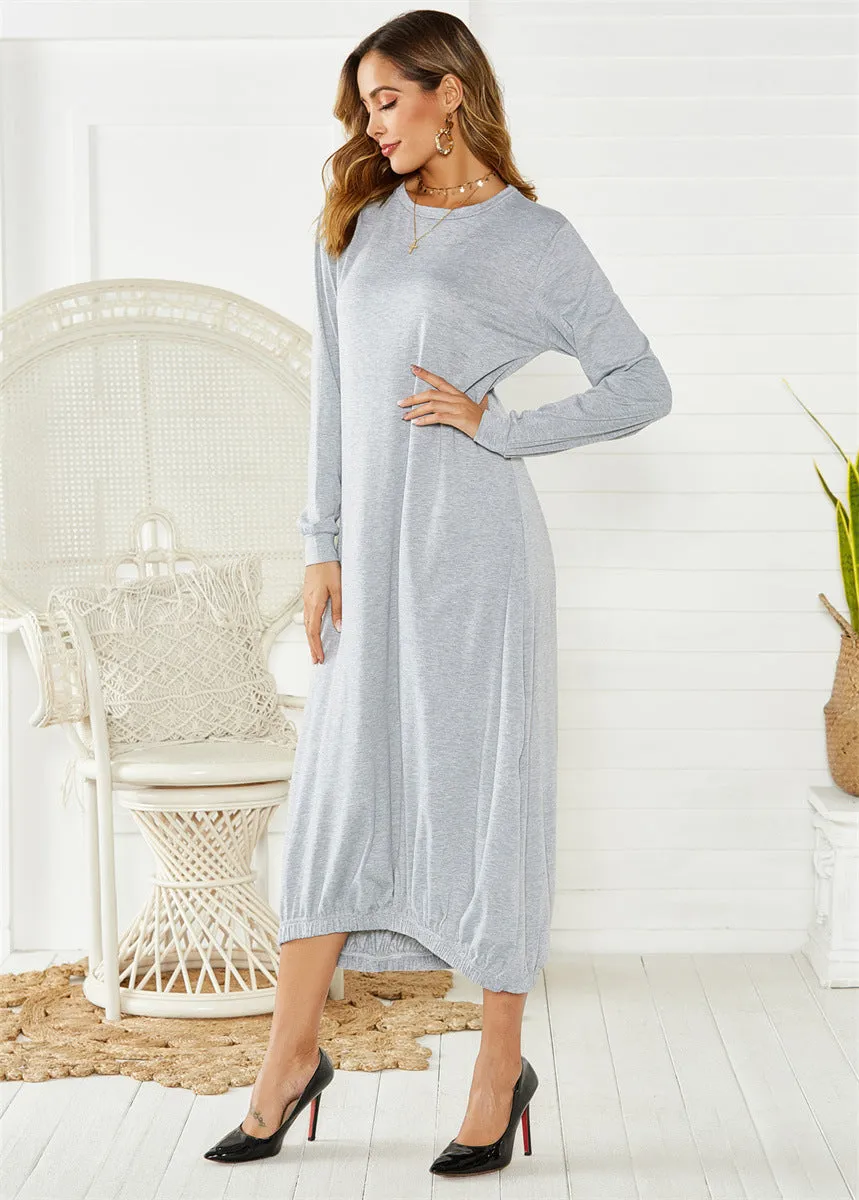 Loose black lantern dress with lace-up crew neck and threads detailing on a mannequin