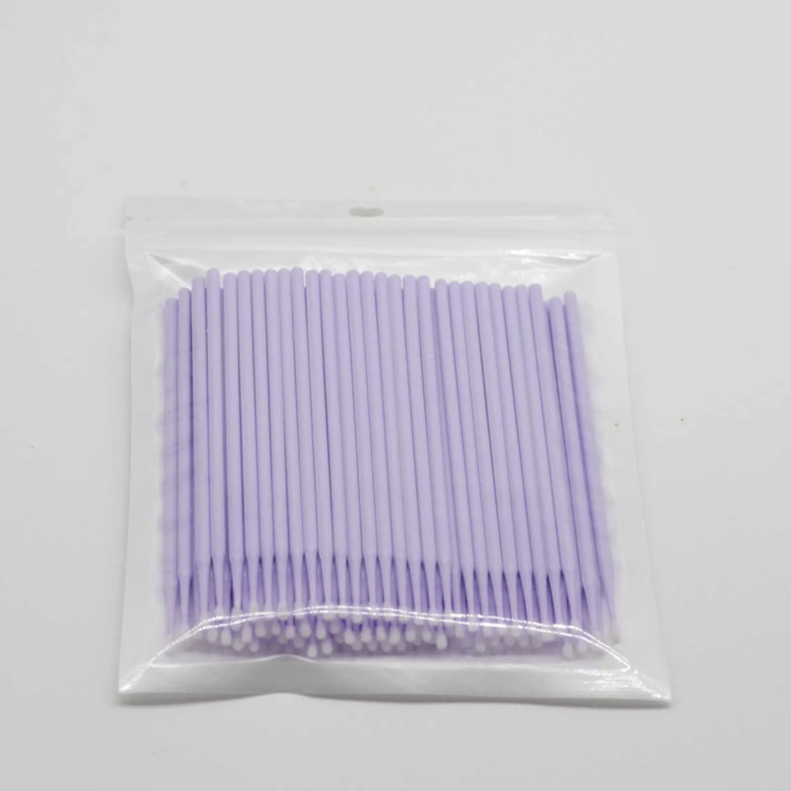 Disposable micro applicator brushes with bendable shafts and flock tips for makeup application
