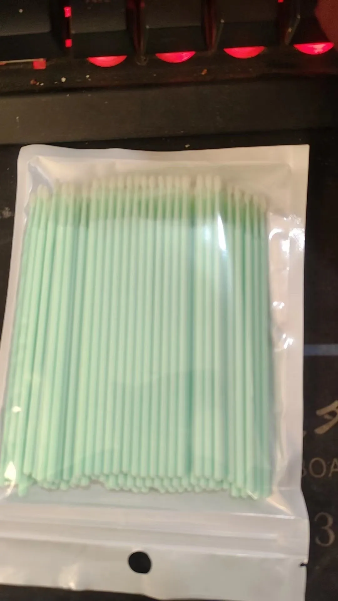 Disposable micro applicator brushes with bendable shafts and flock tips for makeup application