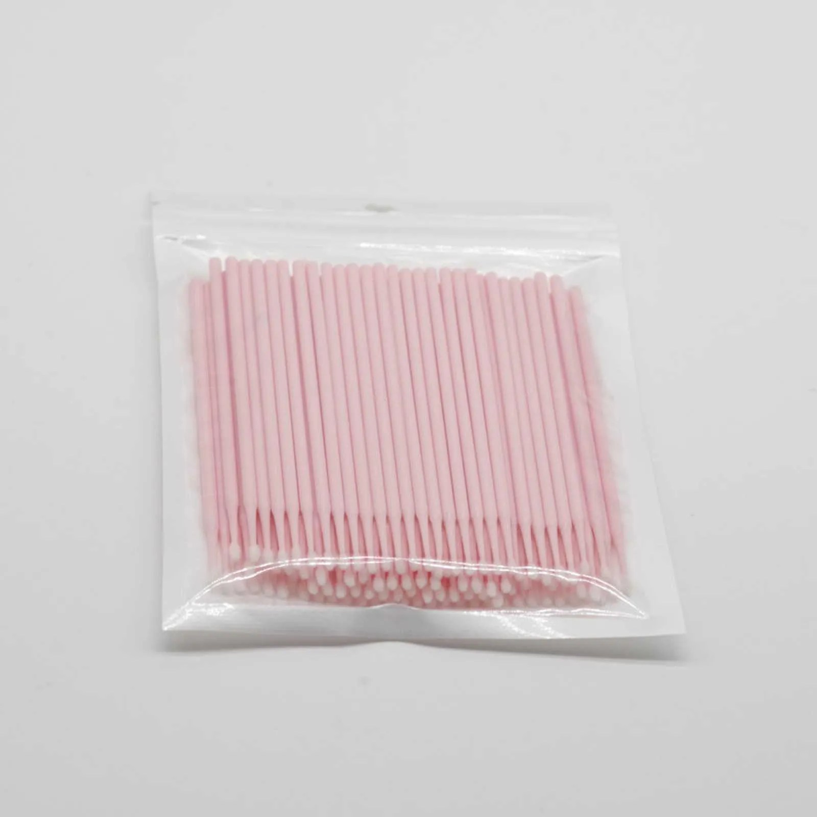Disposable micro applicator brushes with bendable shafts and flock tips for makeup application