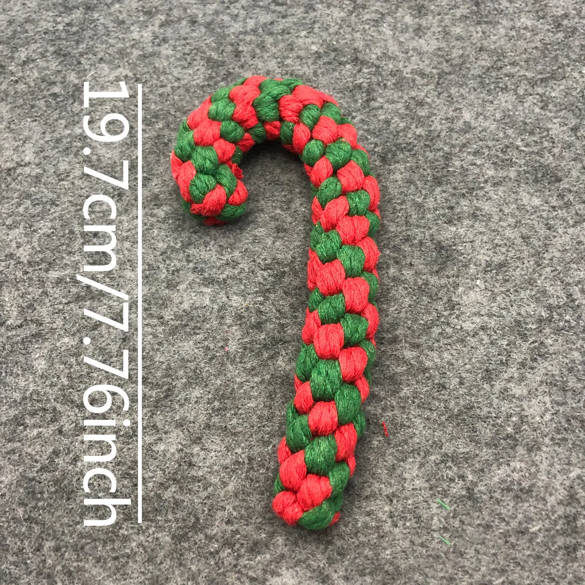 Four Christmas-themed cotton rope dog toys in red and green, including candy cane, bone, crutch, and tree shapes