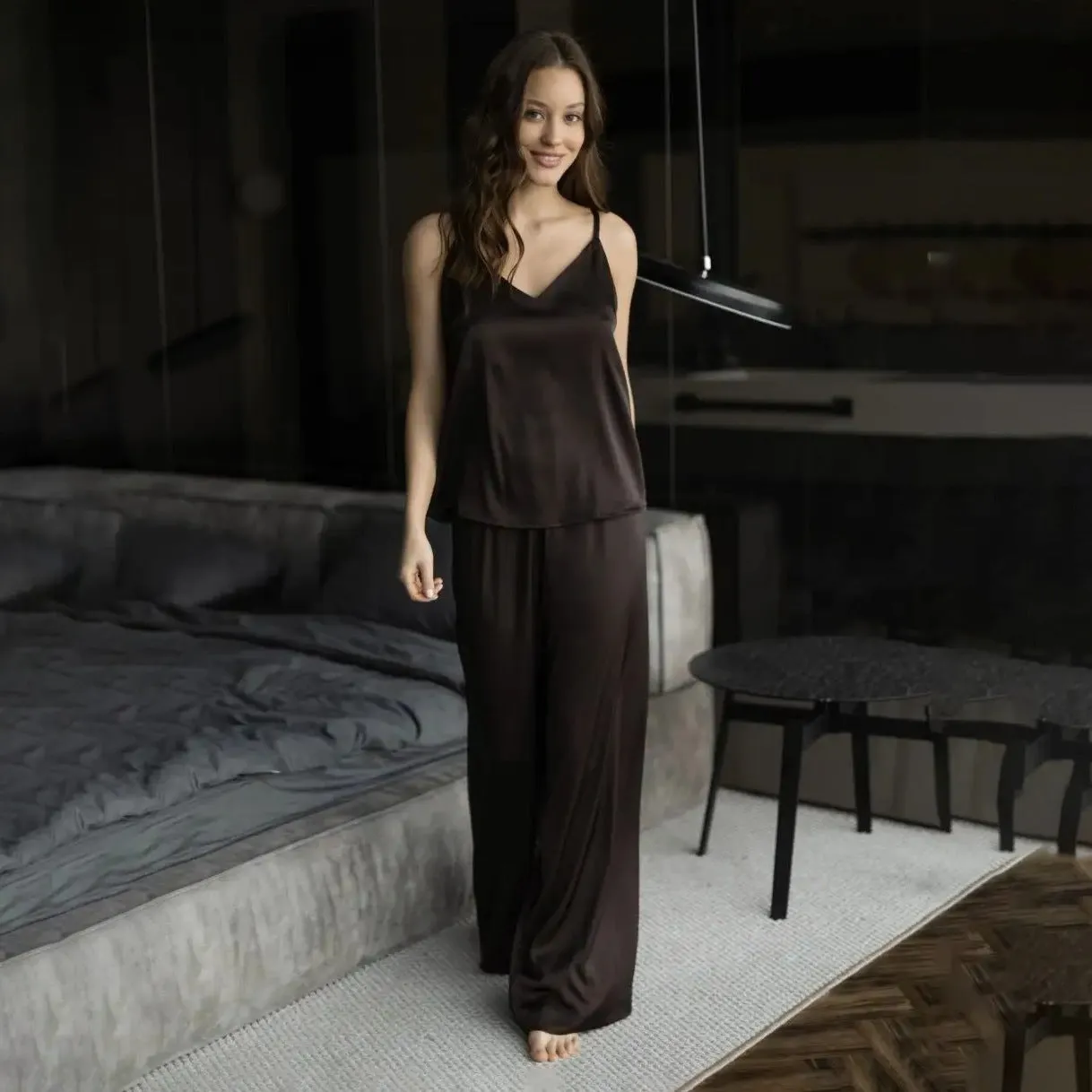 Polyester suspender trousers pyjama suit in navy blue with European American style top and matching trousers on model