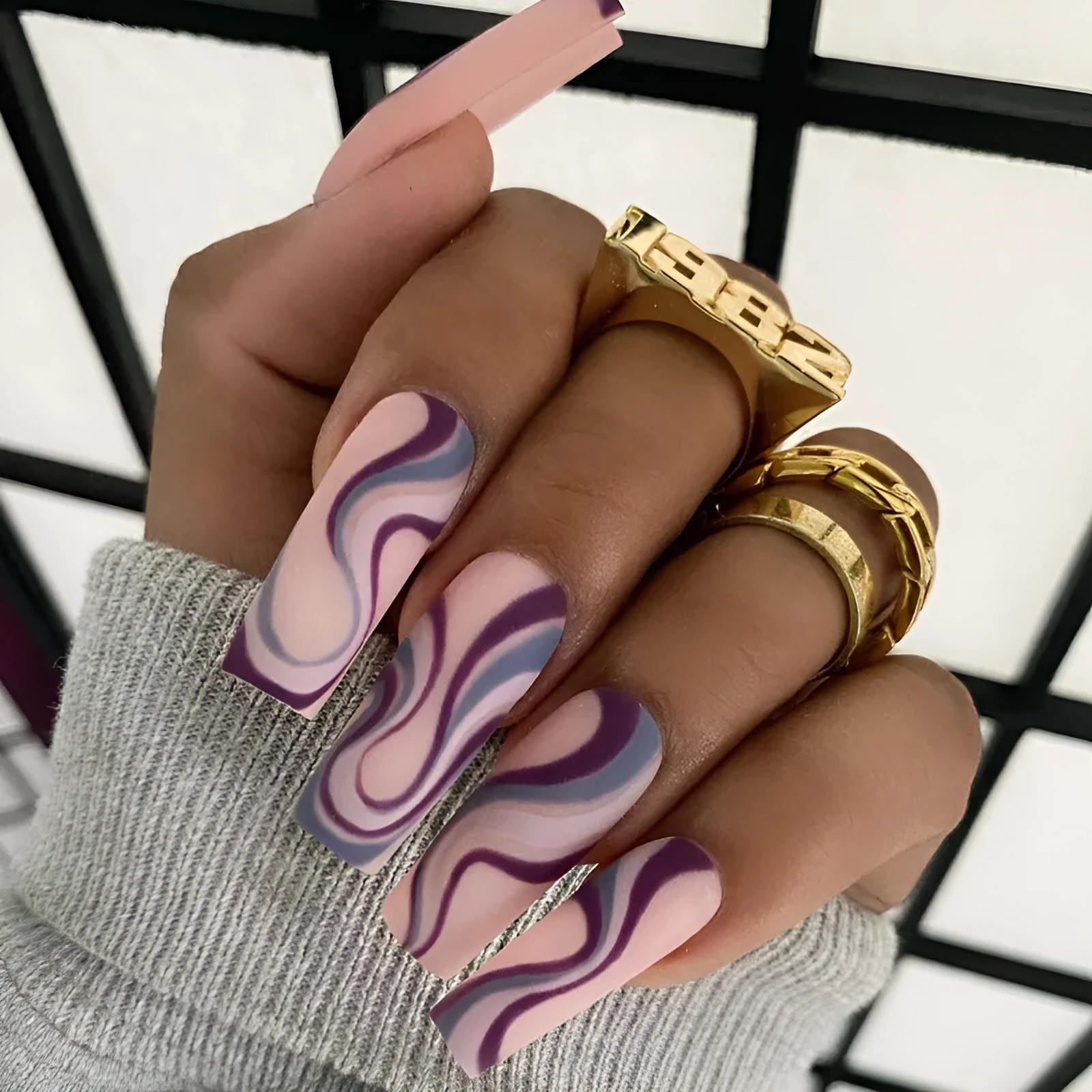 Pack of Ballet W067 wave line patterned nail stickers with pots of jelly glue on a pink background.