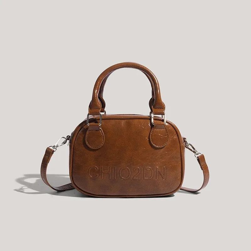 Retro easy matching shoulder crossbody bag in black or brown with letter and stitching design
