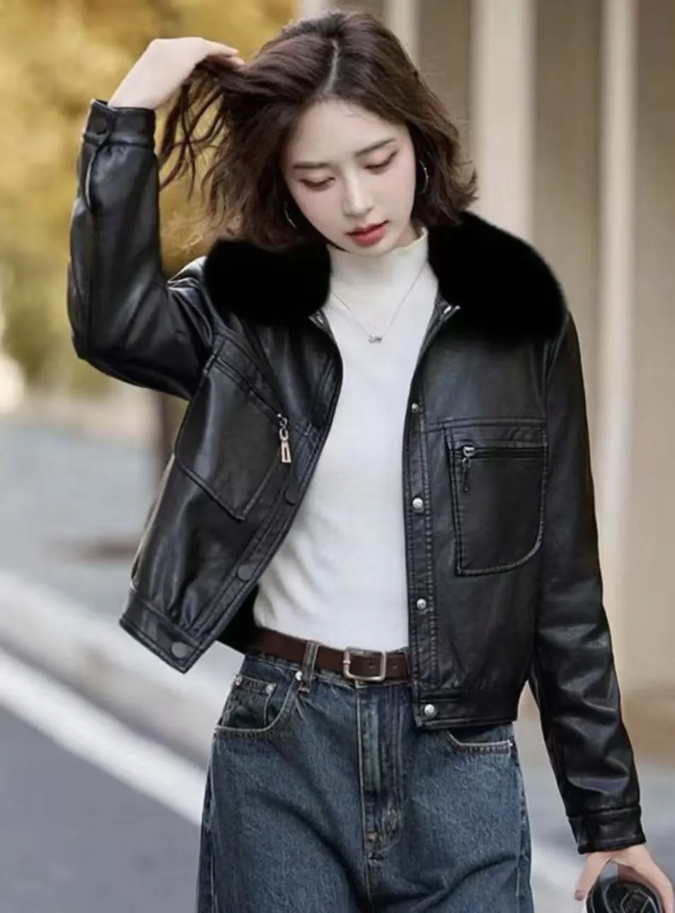 Women's fleece-lined thickened PU leather Western style short lapel coat in black with conventional sleeves