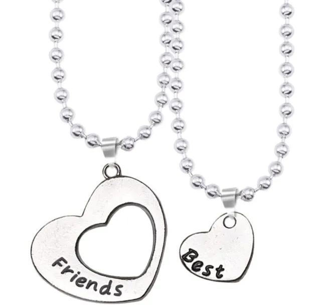 Two silver alloy heart-shaped puzzle necklaces on cross chains, matching set