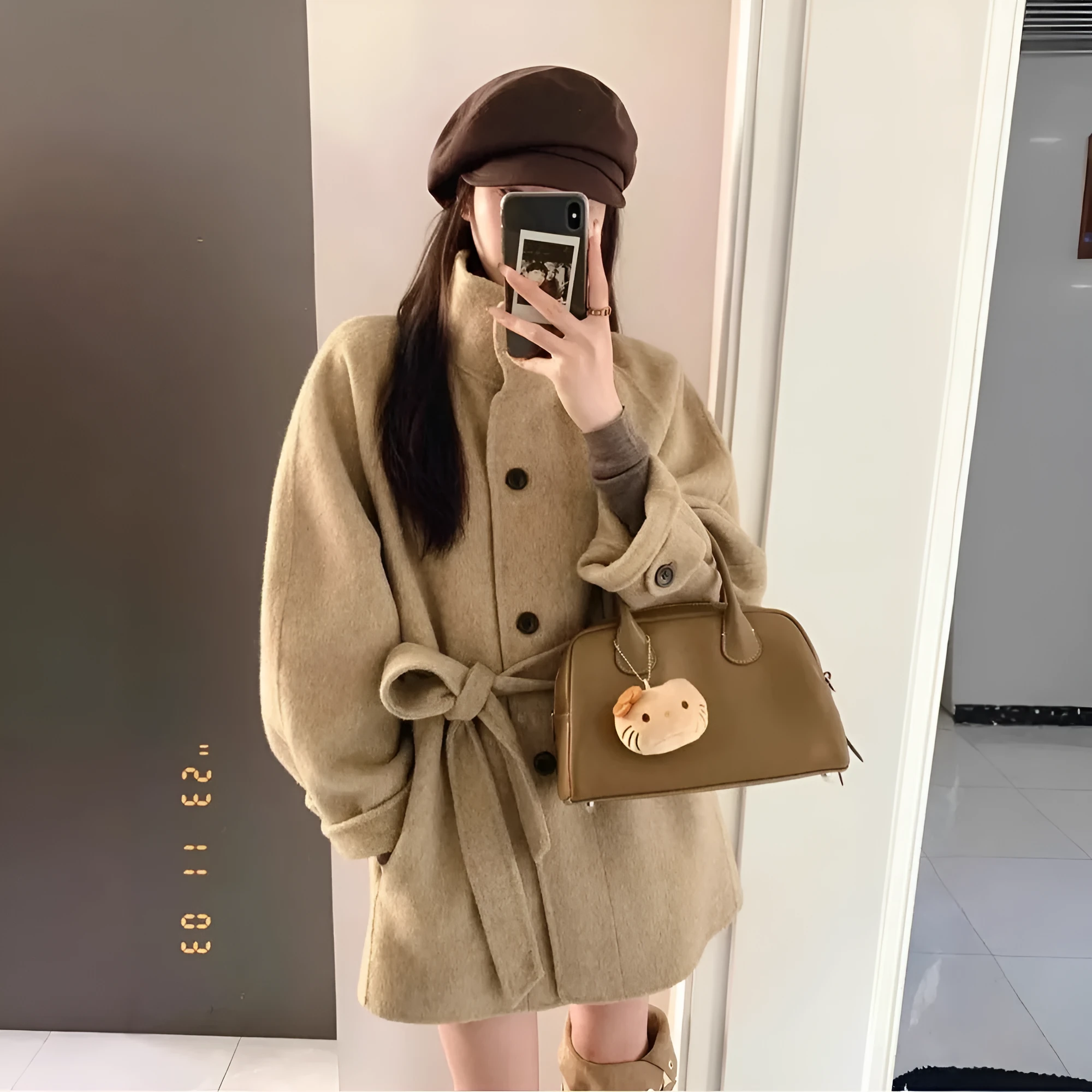 Korean style casual short woolen coat in black with button closure and conventional sleeves