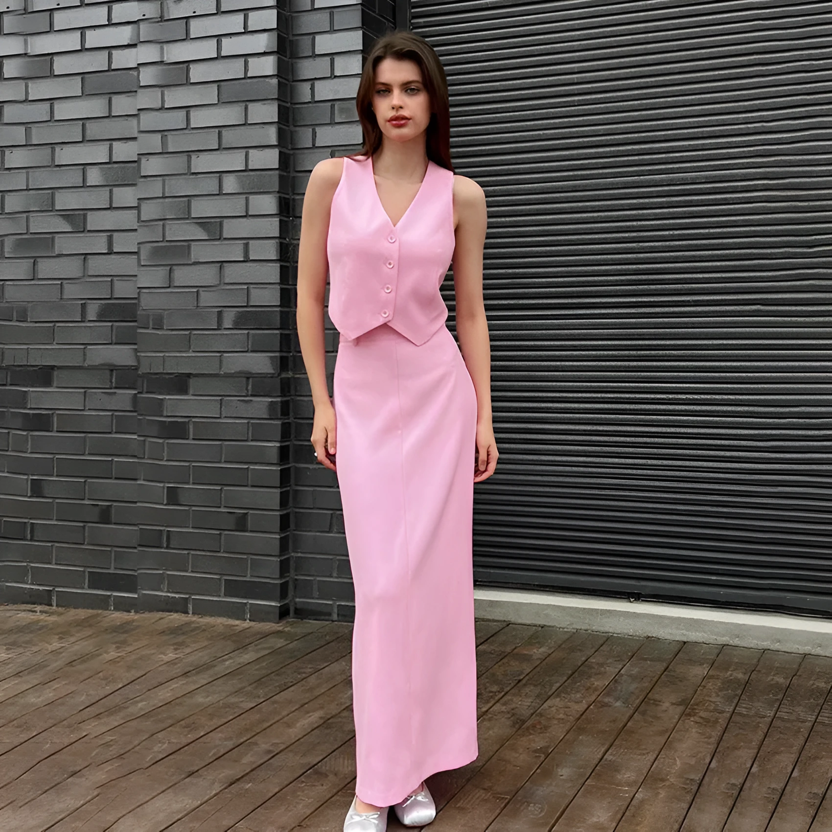 Pink polyester sleeveless vest and long split skirt suit for women