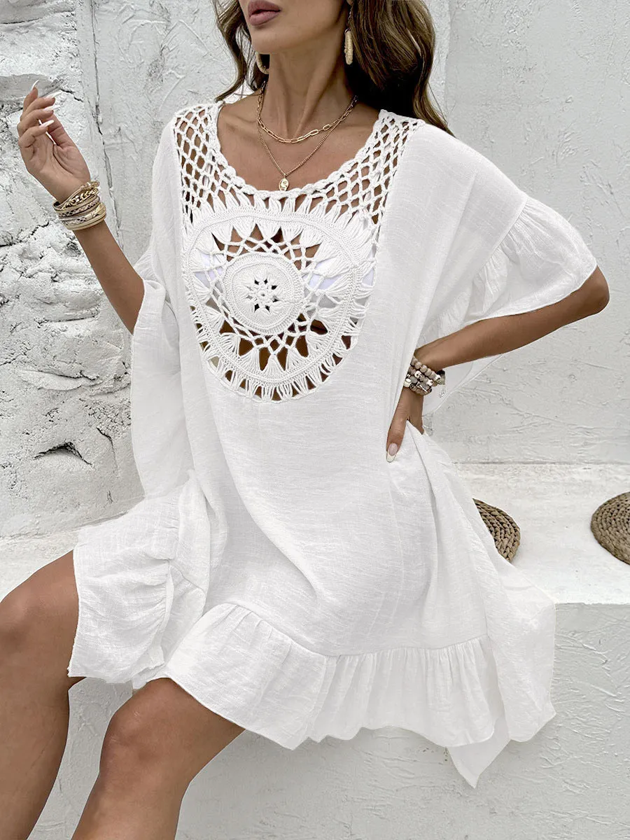 Crochet patchwork beach dress with tassel trim in apricot colour.