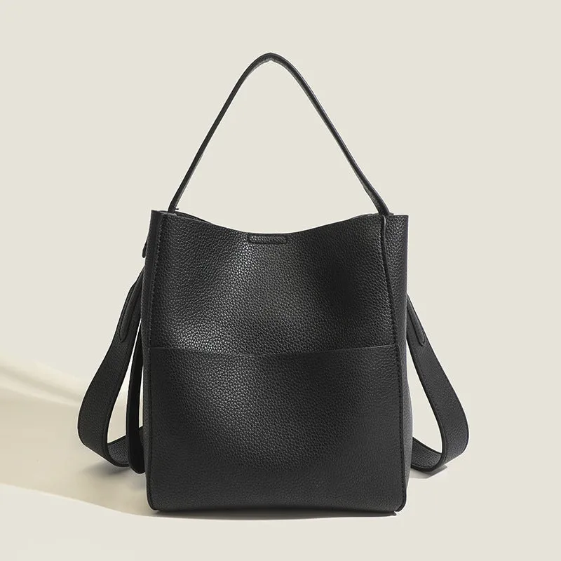 Bucket-style PU messenger bag with sewing line detail, available in black, brown, and elephant gray, on a plain background