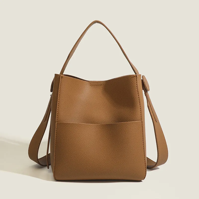 Bucket-style PU messenger bag with sewing line detail, available in black, brown, and elephant gray, on a plain background