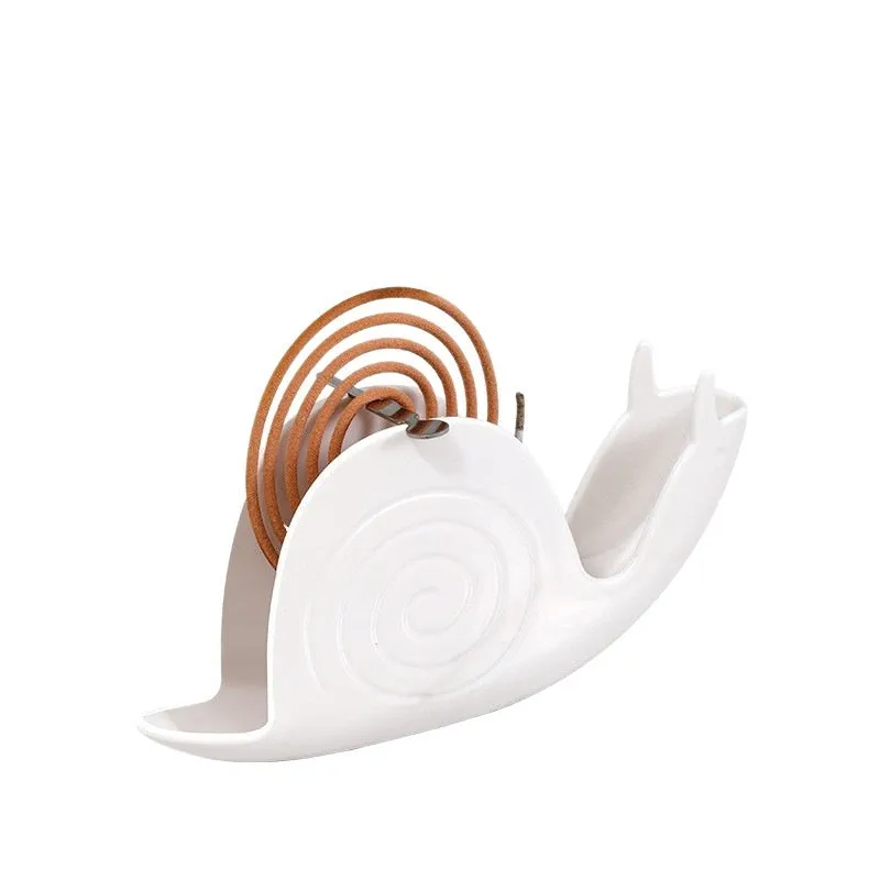 Household plastic mosquito incense holder in white creative animal style on a table