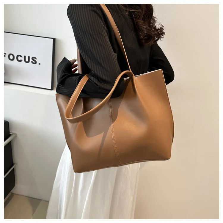 Casual messenger bag in PU leather with stitched detail, bucket shape, double shoulder straps, available in black brown coffee white