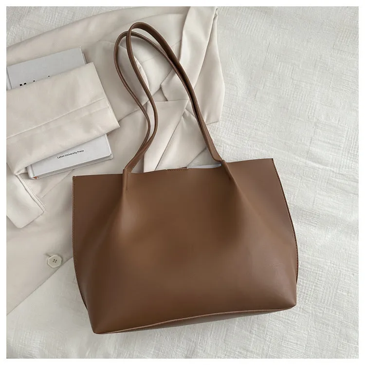 Casual messenger bag in PU leather with stitched detail, bucket shape, double shoulder straps, available in black brown coffee white