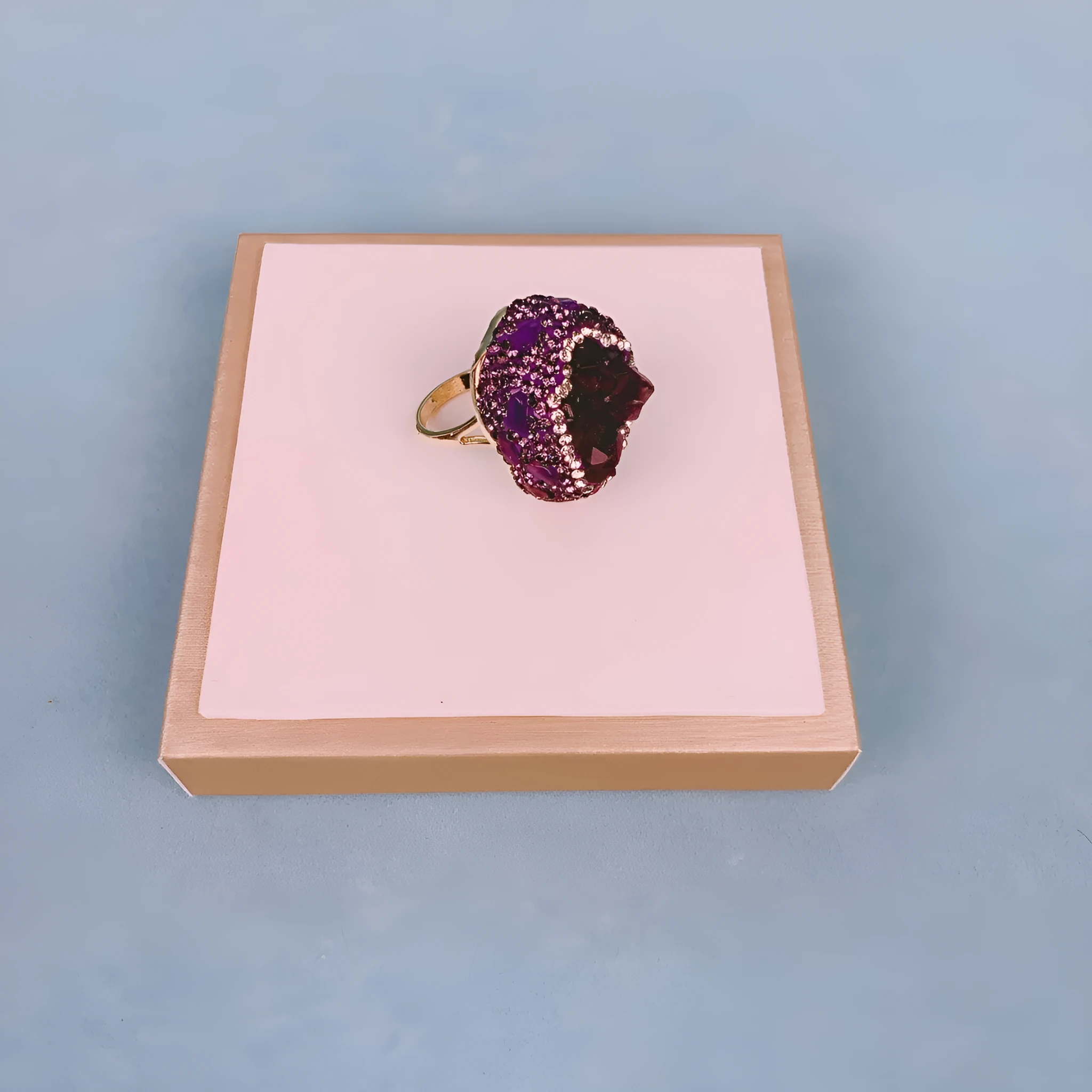 Natural Uruguay amethyst open adjustable ring on a white background showing the gemstone and open band design