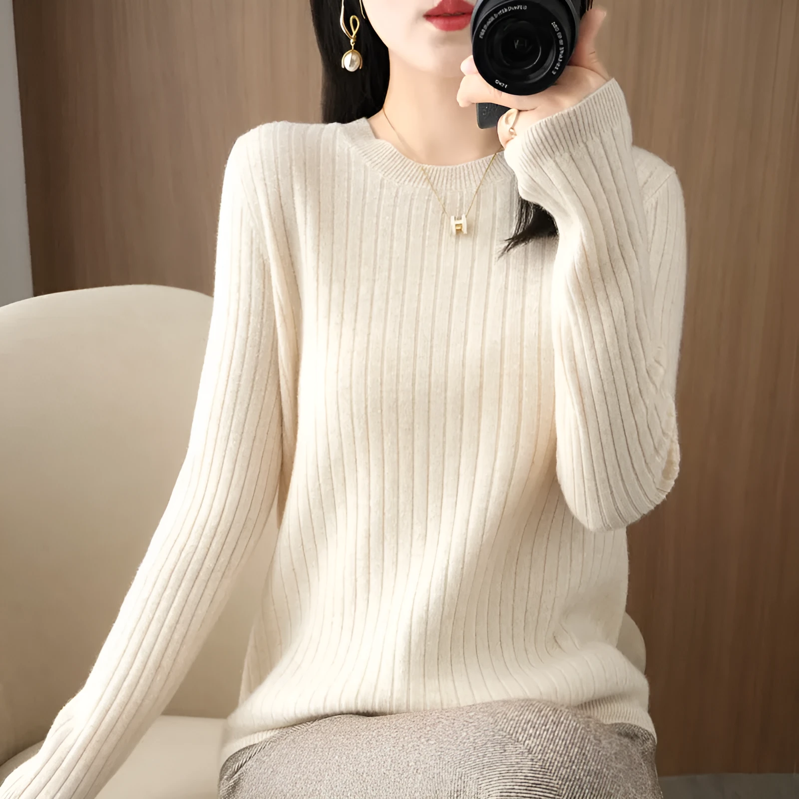 Autumn women's knitwear round neck sweater in beige, low collar long sleeve pullover on model