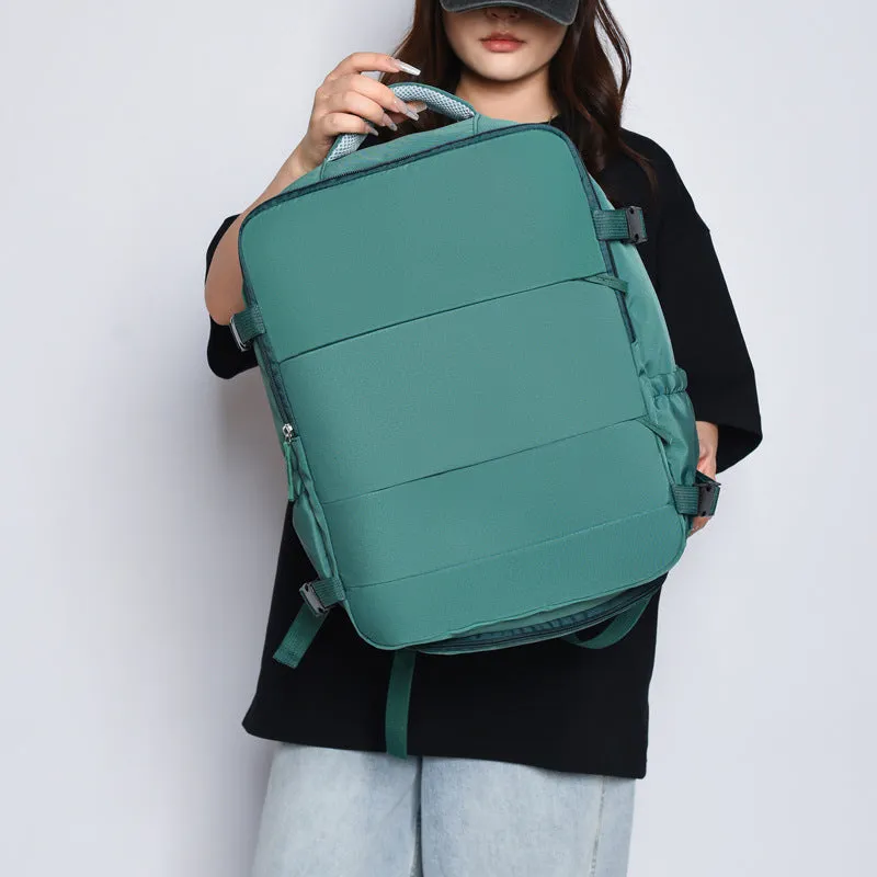 Women's lightweight waterproof solid colour travel backpack in grey with curved shoulder straps and stitching detail