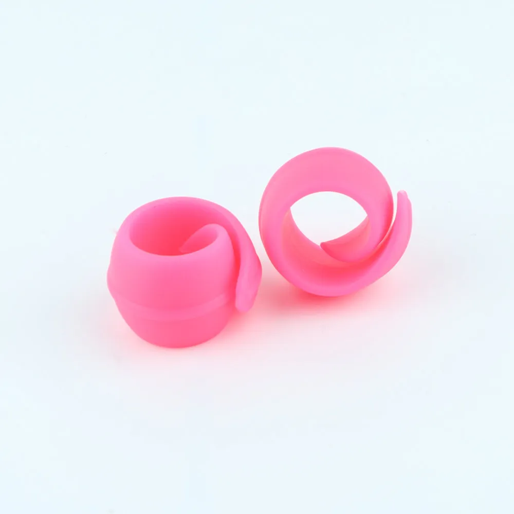 14 silicone sewing spool fixed clips in red, blue, orange, and green on a white background