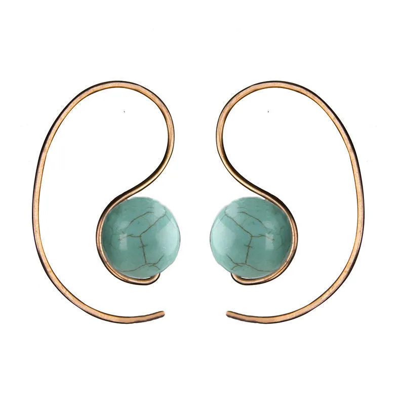 Green turquoise retro style dangle earrings with blue turquoise centrepiece on a white background
