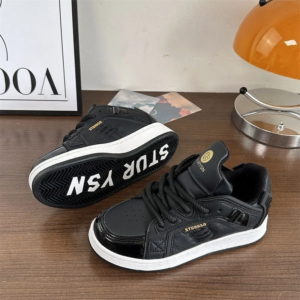 Men's black PU leather round toe board shoes with thick rubber sole on plain background