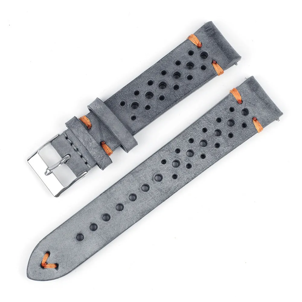 Handmade retro genuine leather watch band in brown with white stitching on a wooden surface