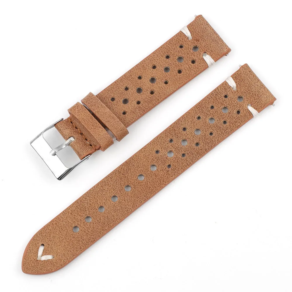 Handmade retro genuine leather watch band in brown with white stitching on a wooden surface