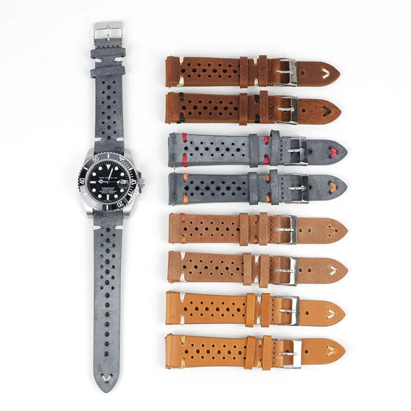 Handmade retro genuine leather watch band in brown with white stitching on a wooden surface