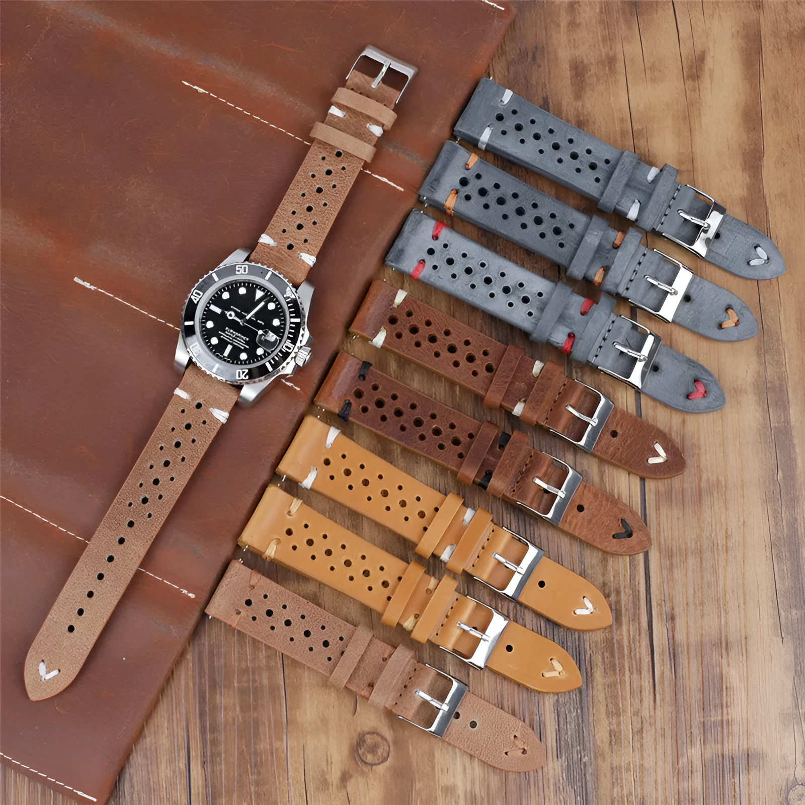 Handmade retro genuine leather watch band in brown with white stitching on a wooden surface