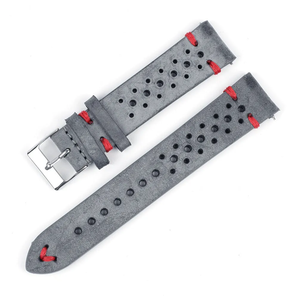 Handmade retro genuine leather watch band in brown with white stitching on a wooden surface