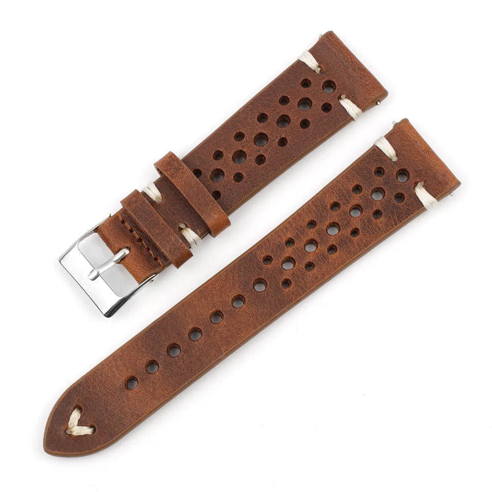 Handmade retro genuine leather watch band in brown with white stitching on a wooden surface