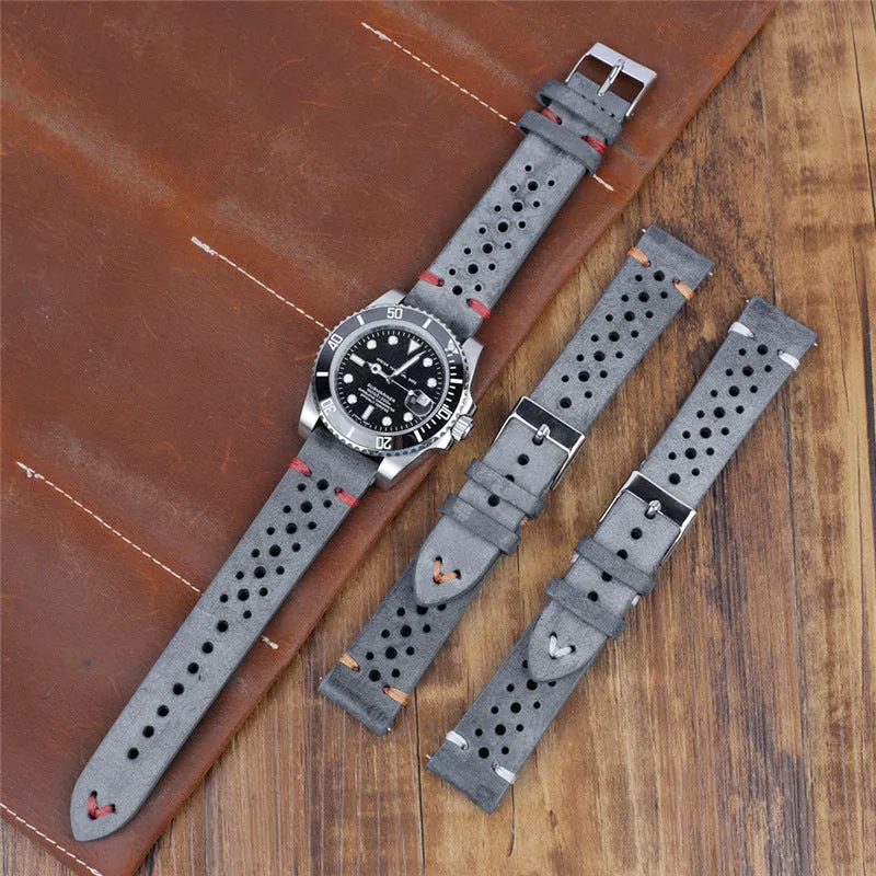 Handmade retro genuine leather watch band in brown with white stitching on a wooden surface