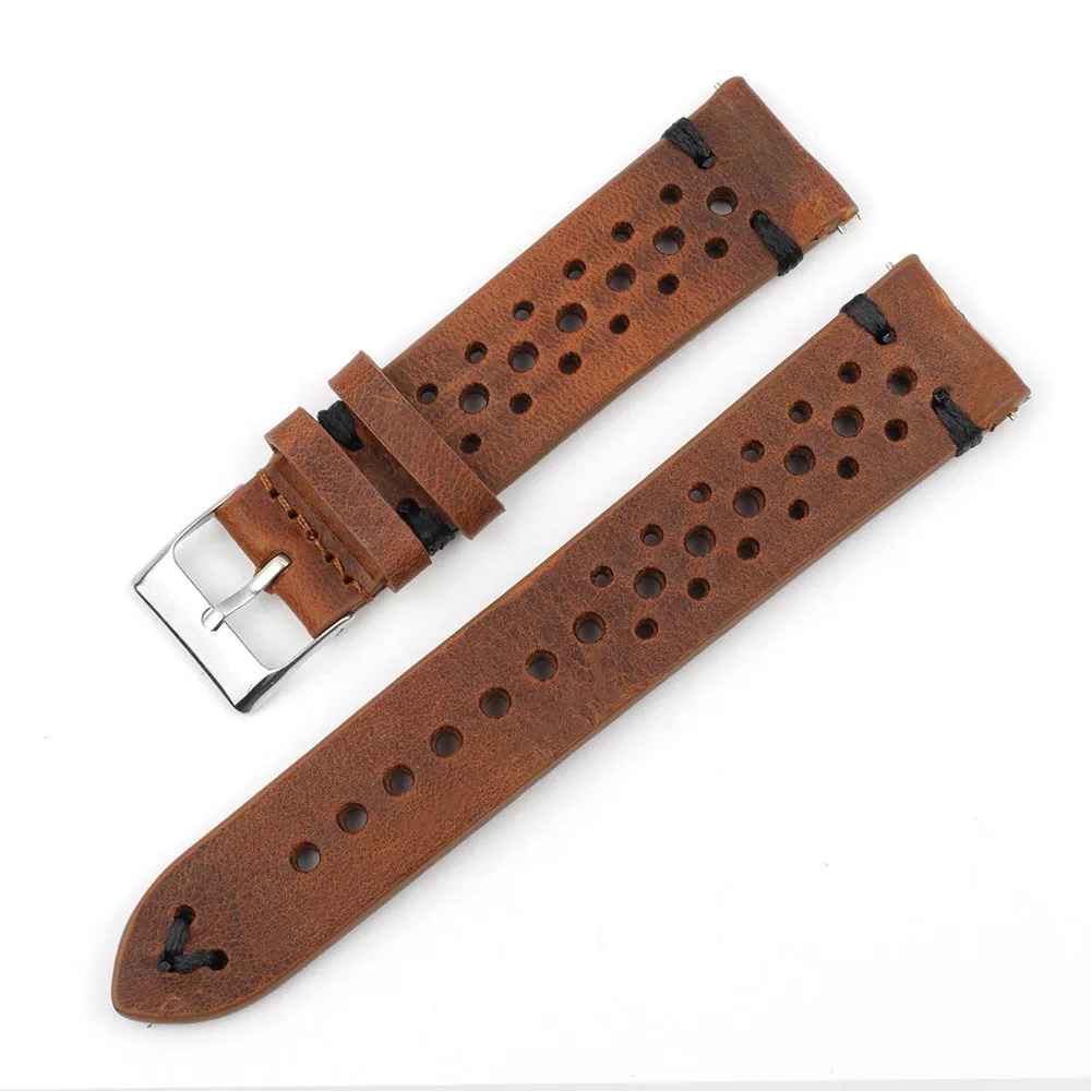Handmade retro genuine leather watch band in brown with white stitching on a wooden surface