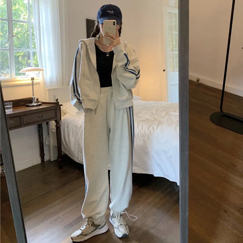 Striped polyester two-piece pants suit set for women in light gray or black with top and trousers coordinated